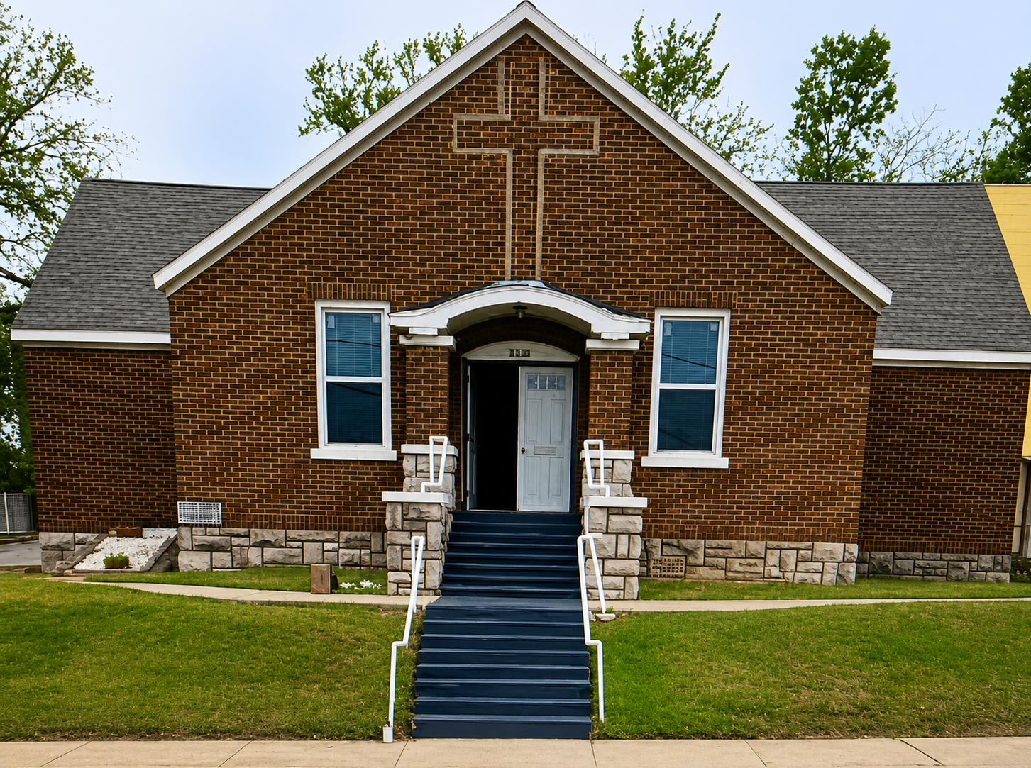 Community Baptist Church of Kansas City building with cross above the entrance